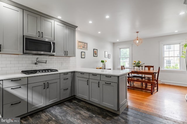 2416 Whitby Rd, Havertown, PA 19083 - kitchen featuring gray cabinets, stainless steel appliances, a peninsula, dark wood-style flooring, and recessed lighting