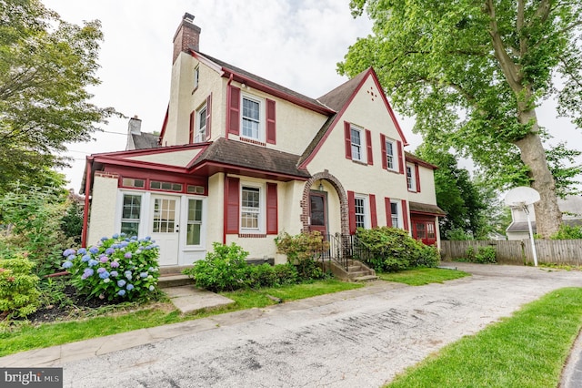 2416 Whitby Rd, Havertown, PA 19083 - view of front of house with stucco siding and a chimney