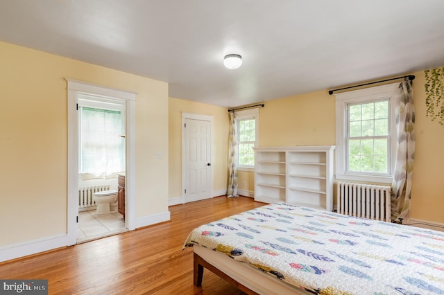 2416 Whitby Rd, Havertown, PA 19083 - bedroom with radiator, light wood-style floors, and multiple windows