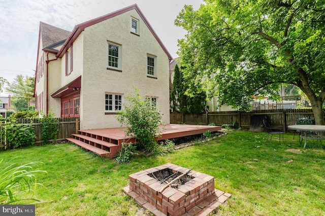 2416 Whitby Rd, Havertown, PA 19083 - rear view of house featuring a fire pit, a fenced backyard, stucco siding, a deck, and roof with shingles