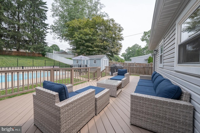 409 Chesterfield Dr, Downingtown, PA 19335 - wooden terrace with an outdoor hangout area, a fenced backyard, a storage unit, and area for grilling