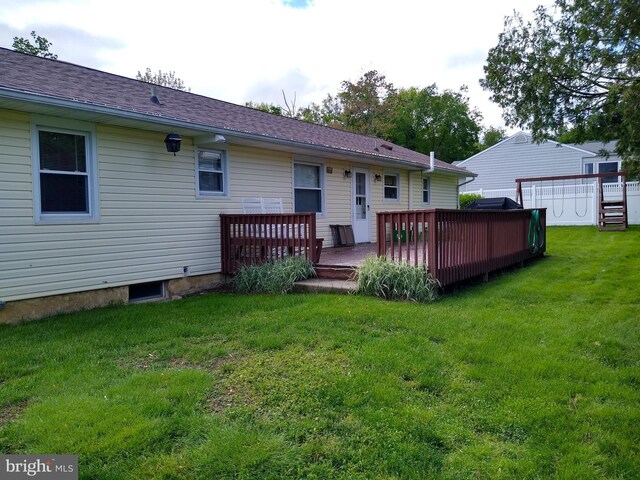 310 Crest Dr, Clarks Green, PA 18411 - rear view of property featuring a deck and a lawn