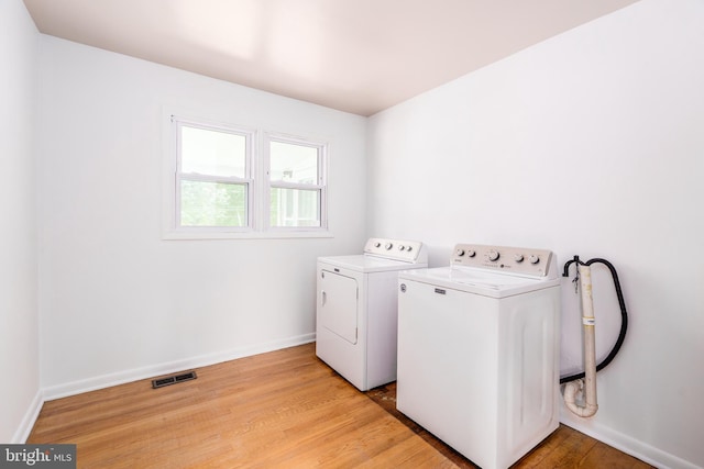 116 Longview Dr, Newark, DE 19711 - washroom featuring washing machine and dryer and light wood-style floors