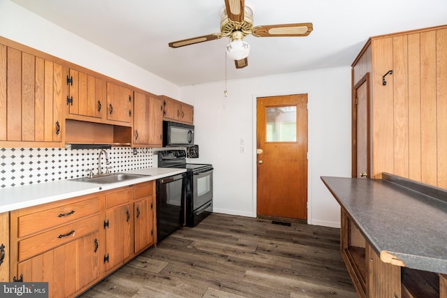 116 Longview Dr, Newark, DE 19711 - kitchen with black appliances, decorative backsplash, a ceiling fan, dark wood finished floors, and brown cabinetry