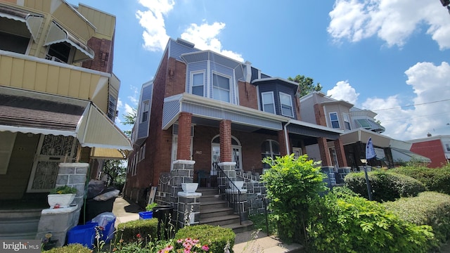 5642 Cedar Ave, Philadelphia, PA 19143 - multi unit property with brick siding and a porch