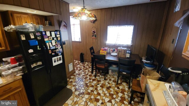 5642 Cedar Ave, Philadelphia, PA 19143 - dining area with wood walls and a desk