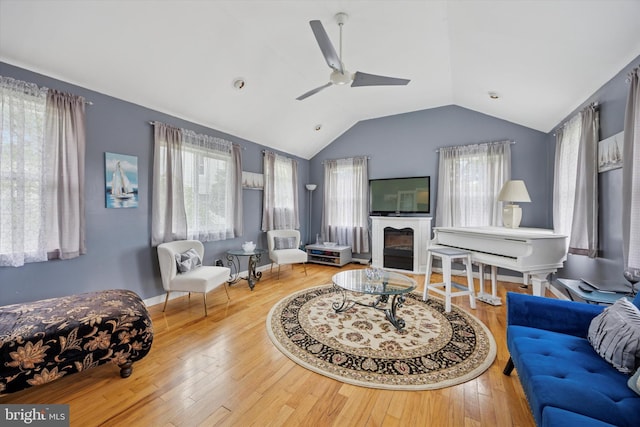 39 E 2nd Ave, Runnemede, NJ 08078 - living area featuring a ceiling fan, lofted ceiling, wood finished floors, and a glass covered fireplace