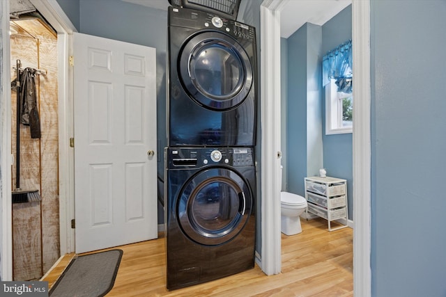 39 E 2nd Ave, Runnemede, NJ 08078 - laundry room featuring estacked washer and dryer and wood finished floors