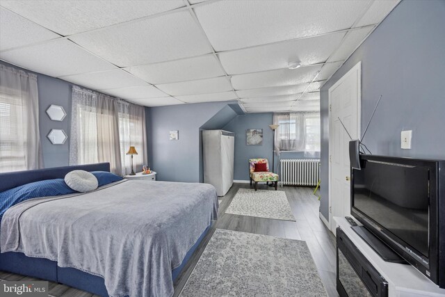 39 E 2nd Ave, Runnemede, NJ 08078 - bedroom with radiator, multiple windows, a drop ceiling, and wood finished floors