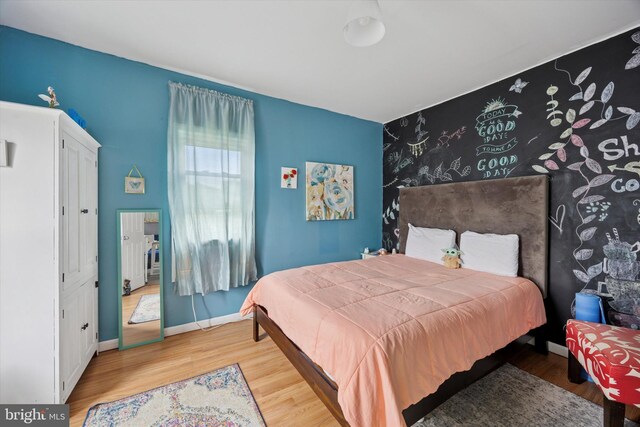 39 E 2nd Ave, Runnemede, NJ 08078 - bedroom with wood finished floors and an accent wall