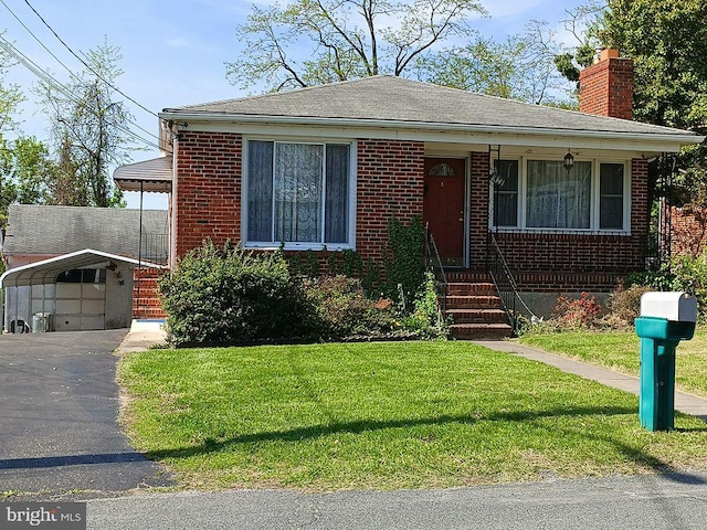 8341 Bear Creek Dr, Baltimore, MD 21222 - bungalow with a chimney, a detached carport, a front yard, brick siding, and asphalt driveway