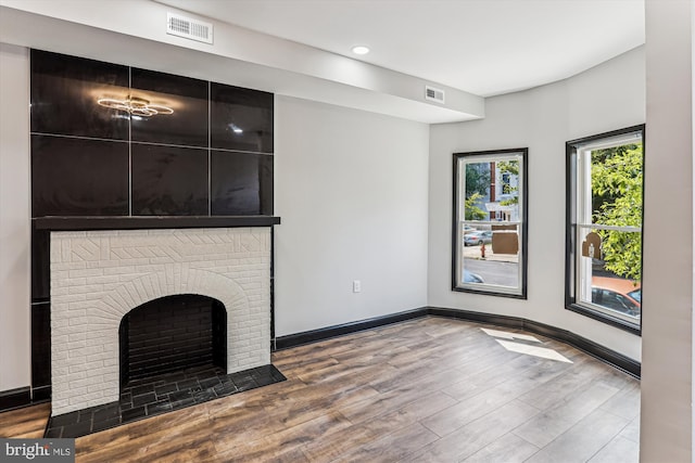 1820 Walbrook Ave, Baltimore, MD 21217 - unfurnished living room featuring wood finished floors, recessed lighting, and a fireplace