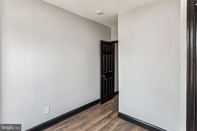 1820 Walbrook Ave, Baltimore, MD 21217 - spare room featuring dark wood-style floors and a smoke detector