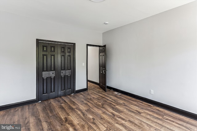 1820 Walbrook Ave, Baltimore, MD 21217 - unfurnished bedroom featuring wood finished floors and baseboards