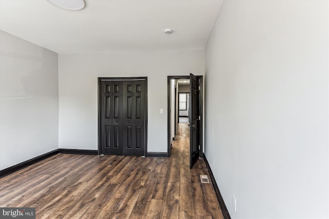 1820 Walbrook Ave, Baltimore, MD 21217 - empty room featuring wood finished floors and a smoke detector