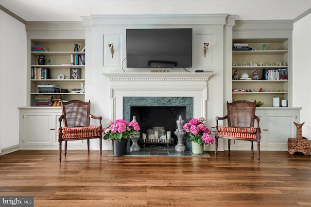 1304 Summit Dr, Bellefonte, PA 16823 - sitting room with crown molding, wood finished floors, built in shelves, and a premium fireplace