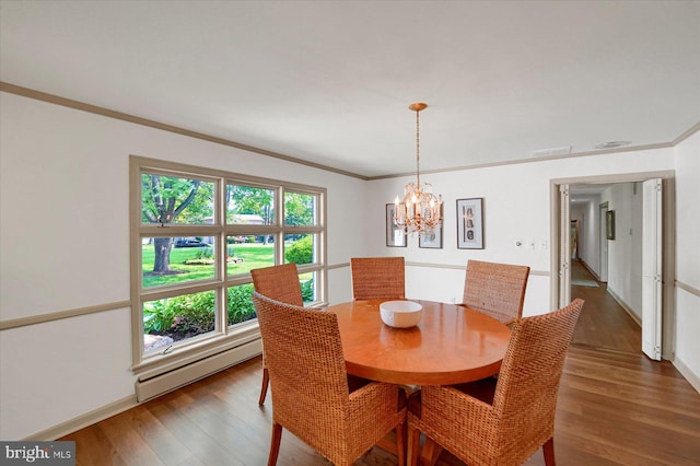 1304 Summit Dr, Bellefonte, PA 16823 - dining room with a baseboard heating unit, wood finished floors, a chandelier, and ornamental molding
