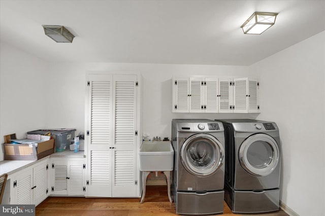 1304 Summit Dr, Bellefonte, PA 16823 - washroom featuring independent washer and dryer, wood finished floors, and cabinet space