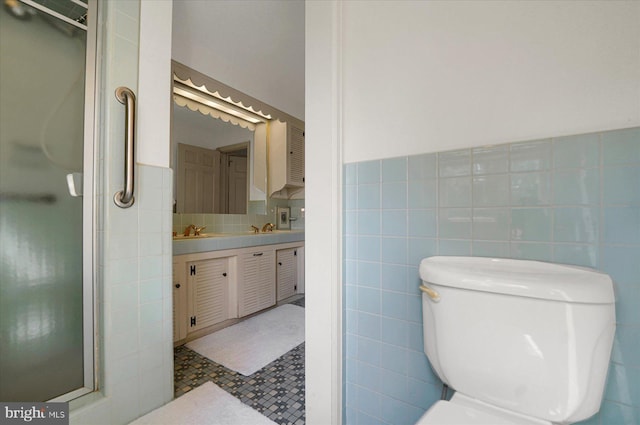 1304 Summit Dr, Bellefonte, PA 16823 - full bath with tile walls, double vanity, a shower stall, and tile patterned flooring
