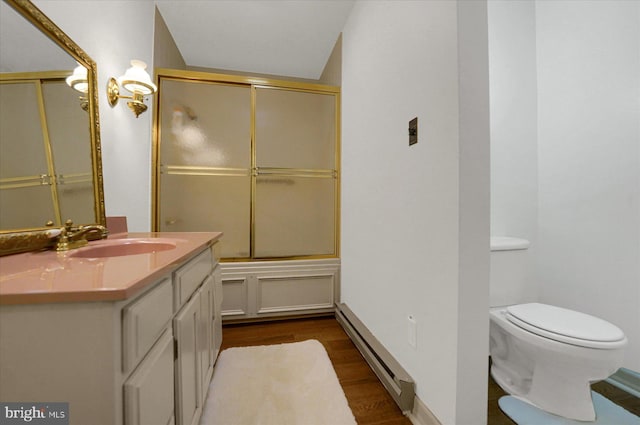 1304 Summit Dr, Bellefonte, PA 16823 - full bath with a baseboard heating unit, vanity, wood finished floors, and bath / shower combo with glass door