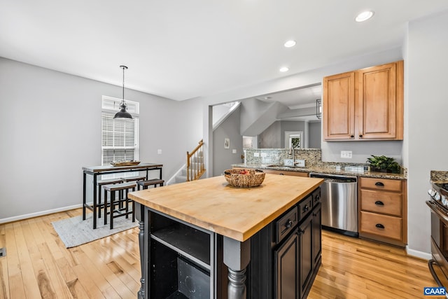 917 Bing Ln, Charlottesville, VA 22903 - kitchen featuring appliances with stainless steel finishes, wooden counters, a kitchen island, light wood-type flooring, and recessed lighting