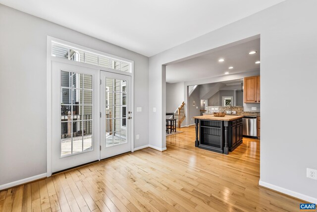 917 Bing Ln, Charlottesville, VA 22903 - kitchen featuring stainless steel dishwasher, light wood-style floors, backsplash, recessed lighting, and a center island