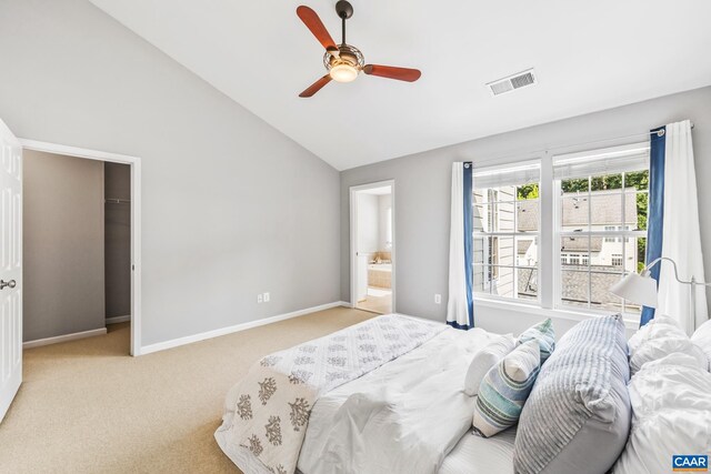 917 Bing Ln, Charlottesville, VA 22903 - carpeted bedroom featuring vaulted ceiling, a walk in closet, a ceiling fan, and ensuite bath