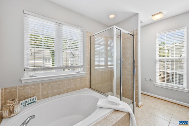 917 Bing Ln, Charlottesville, VA 22903 - bathroom featuring a garden tub, a stall shower, and tile patterned flooring