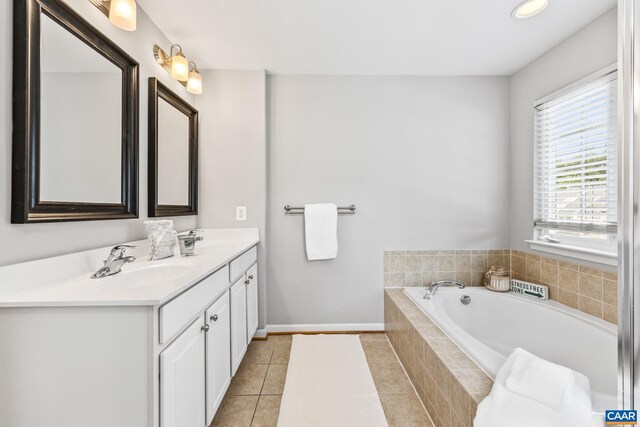 917 Bing Ln, Charlottesville, VA 22903 - full bath featuring double vanity, a bath, and tile patterned floors
