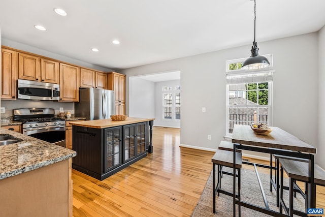 917 Bing Ln, Charlottesville, VA 22903 - kitchen with stainless steel appliances, healthy amount of natural light, recessed lighting, light wood finished floors, and a center island