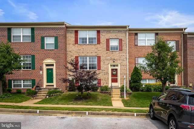 4 Beaver Pond Cir, Baltimore, MD 21234 - townhome / multi-family property with brick siding and a front lawn