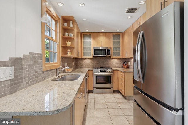 1417 Dorset Ln, Wynnewood, PA 19096 - kitchen featuring appliances with stainless steel finishes, light tile patterned floors, light stone countertops, tasteful backsplash, and glass insert cabinets