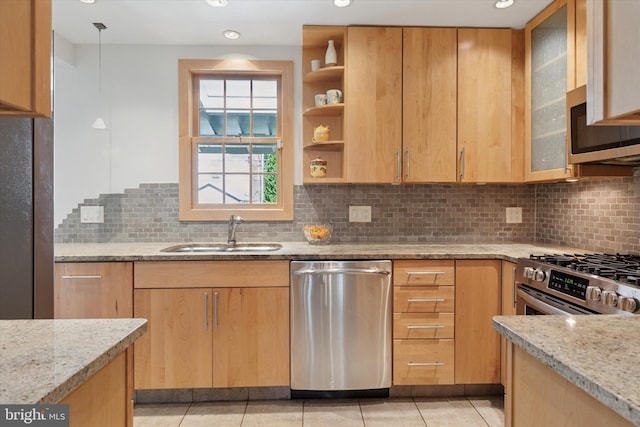 1417 Dorset Ln, Wynnewood, PA 19096 - kitchen with stainless steel appliances, light stone countertops, decorative backsplash, light brown cabinets, and recessed lighting