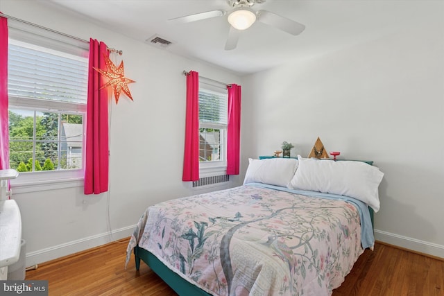 1417 Dorset Ln, Wynnewood, PA 19096 - bedroom with multiple windows, wood finished floors, and ceiling fan