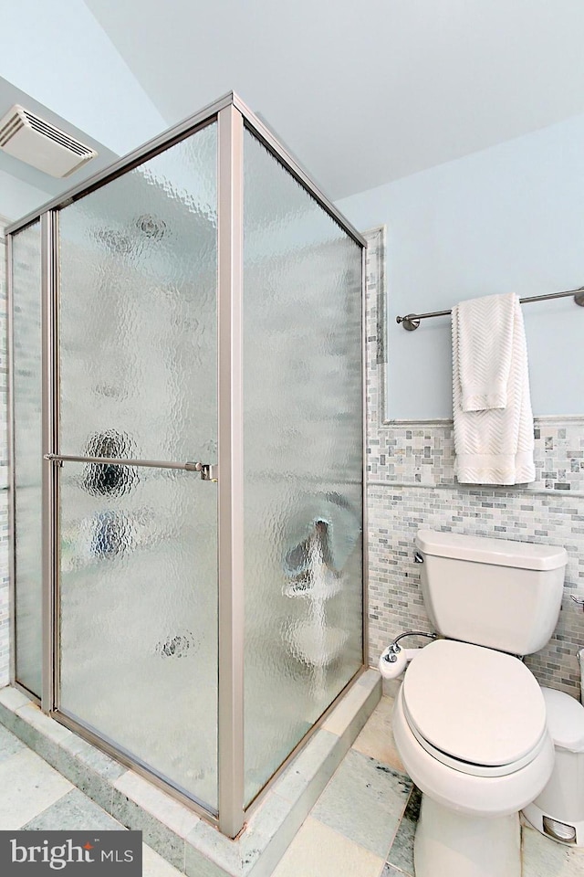 3132 Holmes Run Rd, Falls Church, VA 22042 - bathroom with a stall shower and tile walls