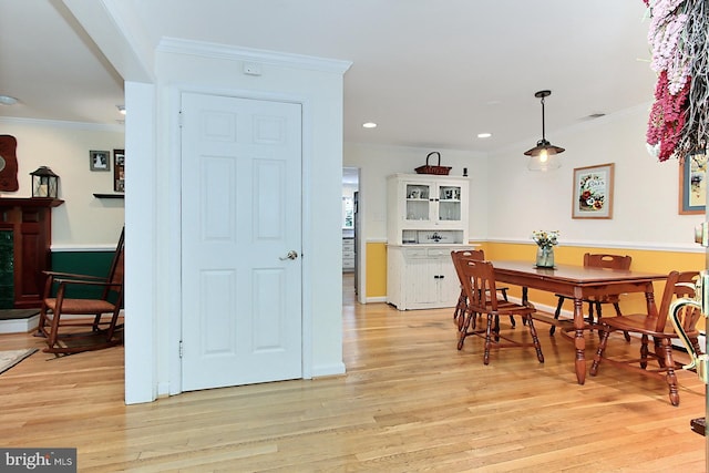 3132 Holmes Run Rd, Falls Church, VA 22042 - dining area with ornamental molding, light wood-style floors, and recessed lighting