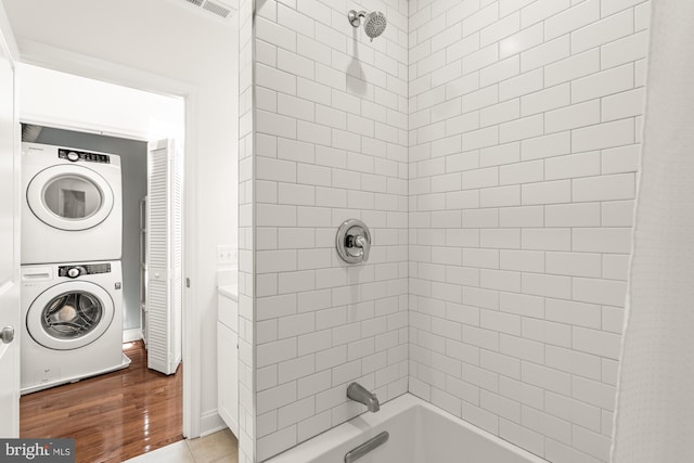 4620 4th St NW, Washington, DC 20011 - bathroom with stacked washing machine and dryer and shower / bath combo