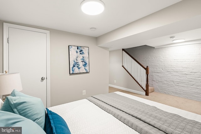 4620 4th St NW, Washington, DC 20011 - carpeted bedroom featuring brick wall and baseboards