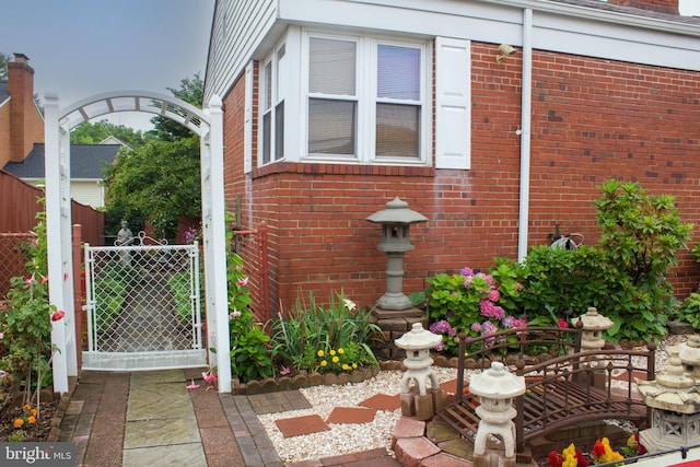 526 S Carlin Springs Rd, Arlington, VA 22204 - view of side of property with a gate and brick siding