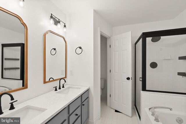 5800 Katelyn Mary Pl Unit 5800, Alexandria, VA 22310 - full bathroom featuring a shower stall, double vanity, a garden tub, and tile patterned flooring