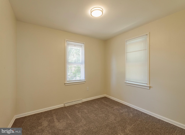 7 Flag St, Pemberton, NJ 08068 - spare room featuring dark carpet and baseboard heating