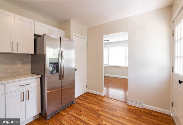 7 Flag St, Pemberton, NJ 08068 - kitchen with stainless steel fridge, light wood-type flooring, white cabinets, and backsplash