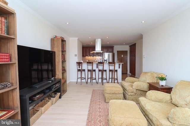 1435 4th St SW Unit B815, Washington, DC 20024 - living area featuring light wood-style flooring, recessed lighting, and ornamental molding