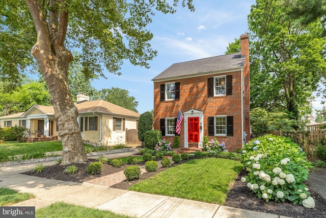 110 E Nelson Ave, Alexandria, VA 22301 - view of front of house with brick siding and a chimney