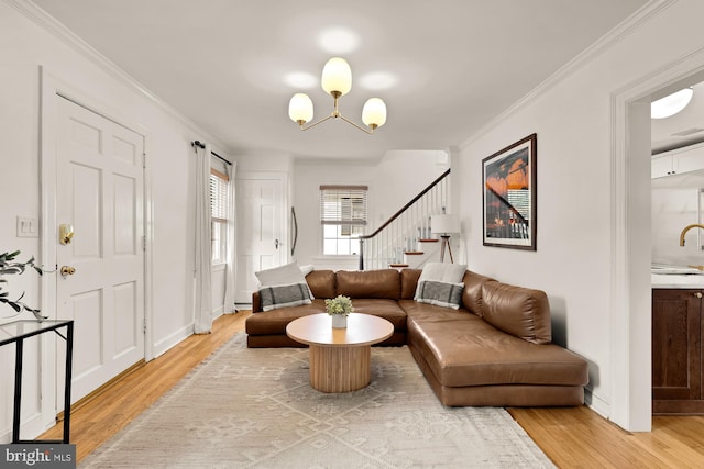 110 E Nelson Ave, Alexandria, VA 22301 - living room with light wood-style flooring, stairs, a chandelier, and ornamental molding