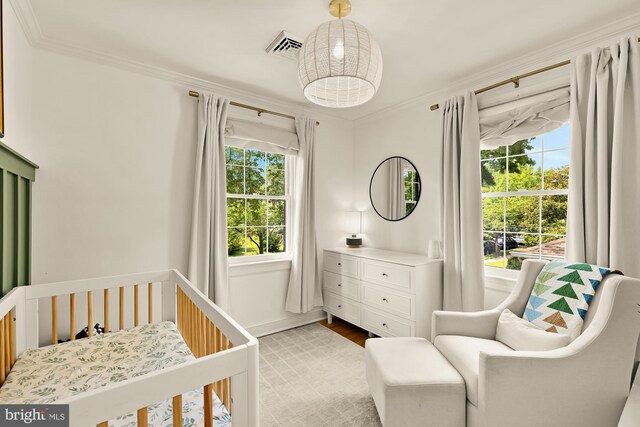 110 E Nelson Ave, Alexandria, VA 22301 - bedroom with a crib, crown molding, and wood finished floors