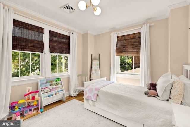 110 E Nelson Ave, Alexandria, VA 22301 - bedroom featuring multiple windows, crown molding, a chandelier, and wood finished floors