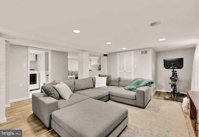 110 E Nelson Ave, Alexandria, VA 22301 - living area featuring light wood-style flooring, ornate columns, recessed lighting, and washer / dryer