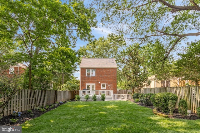 110 E Nelson Ave, Alexandria, VA 22301 - fenced backyard with a wooden deck and french doors