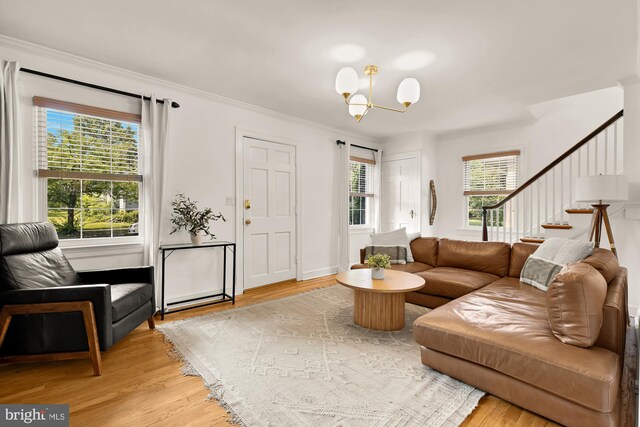 110 E Nelson Ave, Alexandria, VA 22301 - living room featuring a chandelier, stairs, wood finished floors, and ornamental molding